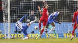 Bayern's Thomas Mueller, center, scores during the German Bundesliga soccer match between Hertha Berlin and Bayern Munich at the Olympic Stadium in Berlin