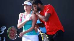 Nadiia Kichenok of Ukraine and Rohan Bopanna of India talk tactics during their Mixed Doubles first round match