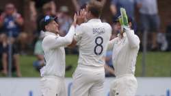 England's wicketkeeper Jos Buttler, right, Stuart Board, center, and Joe Root celebrate the wicket of South Africa's Vernon Philander during day five of the third cricket test between South Africa and England in Port Elizabeth