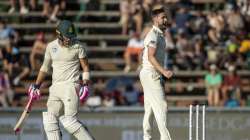 England's bowler Chris Woakes, right, celebrates after dismissing South Africa's captain Faf du Plessis for 3 runs on day two of the fourth cricket test match between South Africa and England at the Wanderers stadium in Johannesburg