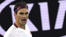 Switzerland's Roger Federer reacts after winning a point against Hungary's Marton Fucsovics during their fourth round singles match at the Australian Open tennis championship in Melbourne, Australia, Sunday