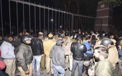  New Delhi: Police and others at out side of the JNU campus, after some masked miscreants attacked i