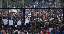 New Delhi: Students stage a protest at main Gate of JNU over Sunday's violence, in New Delhi, Monday, Jan. 6, 2020. A group of masked men and women armed with sticks and rods unleashed violence on the campus of the University in New Delhi, Sunday evening.?(PTI Photo/Atul Yadav)