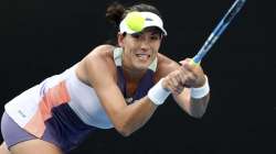 Spain's Garbine Muguruza makes a backhand return to Ukraine's Elina Svitolina during their third round singles match at the Australian Open tennis championship in Melbourne