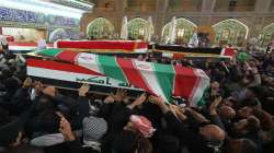 Mourners carry the coffins of Iran's Gen. Qassem Soleimani and Abu Mahdi al-Muhandis, deputy command