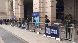 Chinese paramilitary police stand guard outside the closed Hankou Railway Station in Wuhan in central China's Hubei Province, on Jan 23