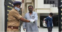 Lucknow's Additional DCP handing over a local resident's medication at his doorstep on Friday