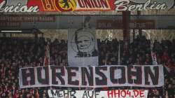 Union fans on the tribune display a banner reading "Son of a bitch" against TSG Hoffenheim club patron Dietmar Hopp during the German Bundesliga soccer match between 1. FC Union Berlin and VfL Wolfsburg, in Berlin