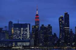 The Empire State building is lit in red and white lights to honor emergency medical workers Tuesday,