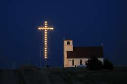 Known as The Lighted Cross Church, Excelsior Lutheran Church near Wilson, Kan., is dark, Friday, Apr