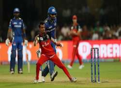 RCB's Yuzvendra Chahal in action against Rohit Sharm's Mumbai Indians