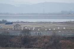 South Korean army soldiers patrol along the barbed-wire fence in Paju, South Korea, near the border 