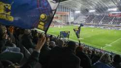 Spectators watch the Super Rugby Aotearoa rugby game between the Highlanders and Chiefs in Dunedin, New Zealand, Saturday, June 13, 2020