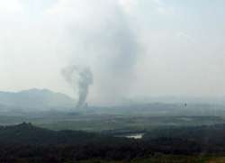 Smoke rises in the North Korean border town of Kaesong, seen from Paju, South Korea, Tuesday, June 1