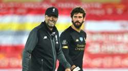 Liverpool goalkeeper Alisson (right) with club manager Jurgen Klopp