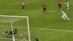 Real Madrid's Sergio Ramos, right, scores the opening goal from a penalty shoot during the Spanish La Liga soccer match between Athletic Club and Real Madrid at the San Manes stadium in Bilbao