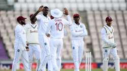 West Indies captain Jason Holder celebrates with Roston Chase after dismissing England captain Ben Stokes during day four of the 1st #RaiseTheBat Test match at The Ageas Bowl on July 11, 2020 in Southampton, England