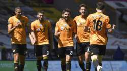 Wolverhampton Wanderers' Diogo Jota, front right, celebrates with teammates after scoring his side's third goal during the English Premier League soccer match between Watford and Everton at the Molineux Stadium in Wolverhampton, England, Sunday, July 12