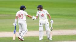 Ollie Pope of England celebrates his half century with Jos Buttler of England(R) during Day One of the Ruth Strauss Foundation Test, the Third Test in the #RaiseTheBat Series match between England and the West Indies at Emirates Old Trafford on July 24