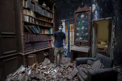 Said Al Assaad, 24, poses for a photograph inside his grandfather's destroyed villa after Tuesday's explosion in the seaport of Beirut, Lebanon