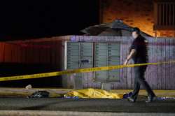 Officials work at the area late Thursday, Sept. 3, 2020, in Lacey Wash., where a man suspected of fa