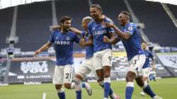 Everton's Dominic Calvert-Lewin, second right, celebrates with teammates after scoring his side's opening goal during the English Premier League soccer match between Tottenham Hotspur and Everton at the Tottenham Hotspur Stadium in London, Sunday, Sept. 13