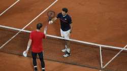 Britain's Andy Murray congratulates Switzerland's Stan Wawrinka after Murray lost in three sets 1-6, 3-6, 2-6, in the first round match of the French Open tennis tournament at the Roland Garros stadium in Paris, France, Sunday, Sept. 27