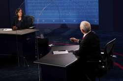 Democratic vice presidential candidate Sen. Kamala Harris, D-Calif., listens as Vice President Mike 