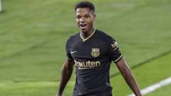 Barcelona's Ansu Fati celebrates after scoring the opening goal during the Spanish La Liga soccer match between RC Celta and FC Barcelona in Vigo, Spain, Thursday, Oct. 1