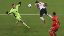 England's Dominic Calvert-Lewin, right, heads the ball to score during the international friendly soccer match between England and Wales at Wembley stadium in London, Thursday Oct. 8