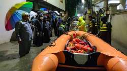 Disaster management officials carry out rescue works following heavy rainfall in Hyderabad