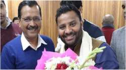 Aam Aadmi Party MLA Kuldeep Kumar with Arvind Kejriwal. He has been booked under the Epidemic Act.?