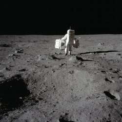 In this July 20, 1969 photo made available by NASA, lunar module pilot Buzz Aldrin carries a seismic