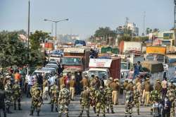 Police stand guard on the Singhu border as farmers march towards Delhi as part of Delhi Chalo protest against the farm reform bills.