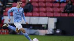 Manchester City's Phil Foden controls the ball during the English Premier League soccer match between Sheffield United and Manchester City at Bramall Lane stadium in Sheffield, England, Saturday, Oct. 31