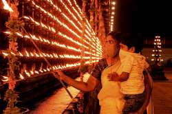 People light earthen lamp (Diyas) on the occasion of Diwali, in Thrippunithura