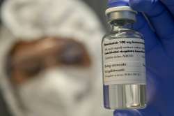 A bottle containing the drug Remdesivir is held by a health worker at the Institute of Infectology o