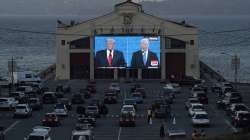 People watch from their vehicles as Donald Trump and Joe Biden speak during a Presidential Debate Watch Party at Fort Mason Center in San Francisco on October 22.