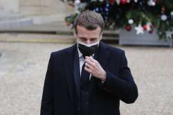 French President Emmanuel Macron reacts as he meets Portuguese Prime Minister Antonio Costa, Wednesday, Dec. 16, 2020 in Paris. French President Emmanuel Macron has tested positive for COVID-19, the presidential Elysee Palace announced on Thursday.
 