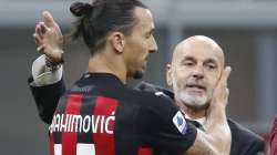 In this Saturday, Oc.t 17, 2020 file photo, AC Milan manager Stefano Pioli, right, congratulates Zlatan Ibrahimovic at the end of the Serie A soccer match between Inter Milan and AC Milan