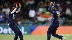 India's Sanju Samson, right celebrates with teammate India's Deepak Chahar after taking catch to dismiss Australia's Steve Smith during their T20 international cricket match at Manuka Oval, in Canberra, Australia, Friday, Dec 4