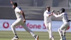 India's Ravichandran Ashwin, left, celebrates taking the wicket of Australia's Steve Smith for 1 run on the second day of their cricket test match at the Adelaide Oval in Adelaide, Australia, Friday, Dec. 18