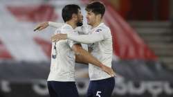 Manchester City's Ruben Dias, left, hugs teammate John Stones at the end of the English Premier League soccer match between Southampton and Manchester City at the St Mary's Stadium, in Southampton, Saturday, Dec. 19