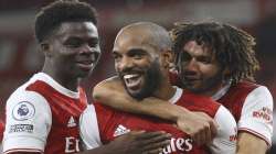 Arsenal's Alexandre Lacazette, centre, celebrates after scoring the opening goal of the game from the penalty spot during their English Premier League soccer match between Arsenal and Chelsea at the Emirates stadium in London, Saturday, Dec. 26