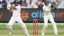 India's Rishabh Pant bats as Australian wicketkeeper Tim Paine, right, watches during play on day two of the second cricket test between India and Australia at the Melbourne Cricket Ground, Melbourne, Australia, Sunday, Dec. 27