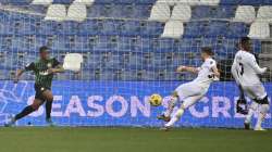 AC Milan's Alexis Saelemaekers, center, scores his side's 2nd goal during the Serie A soccer match between Sassuolo and AC Milan at the Mapei Stadium in Reggio Emilia, Italy, Sunday, Dec. 20