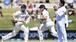 New Zealand batsmen Kane Williamson, left, and Henry Nicholls take a run during play on day two of the first cricket test between Pakistan and New Zealand at Bay Oval, Mount Maunganui, New Zealand, Sunday