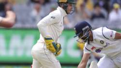 India's Ajinkya Rahane, right, is run out by Australia's Tim Paine, left, during play on day three of the second cricket test between India and Australia at the Melbourne Cricket Ground, Melbourne, Australia, Monday, Dec. 28