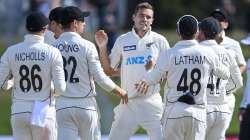 New Zealand's Tim Southee, centre, celebrates his 300th test wicket with teammates after dismissing Pakistan's Haris Sohail during play on day four of the first cricket test between Pakistan and New Zealand at Bay Oval, Mount Maunganui, New Zealand, Tuesday, Dec. 29