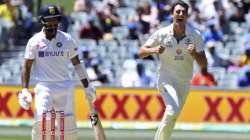 Australia's Pat Cummins, right, celebrates the wicket of India's Cheteshwar Pujara, left, on the third day of their cricket test match at the Adelaide Oval in Adelaide, Australia, Saturday, Dec. 19